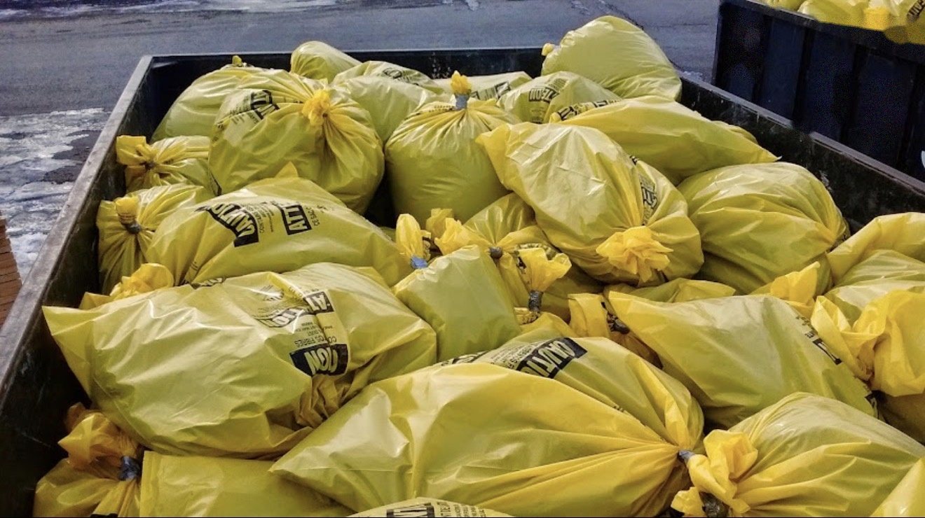 Labelled asbestos waste bags sealed and ready for transport