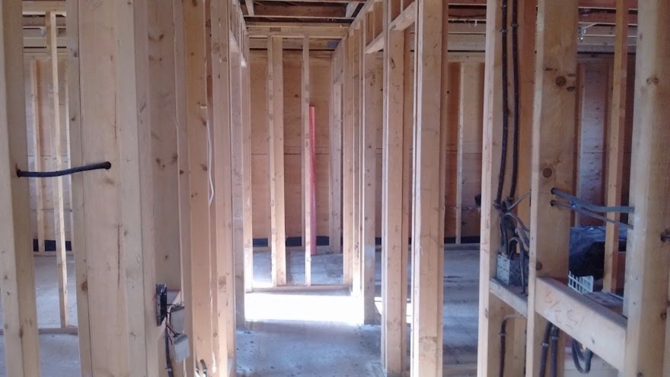 Interior stripped to the framing after abatement and demolition